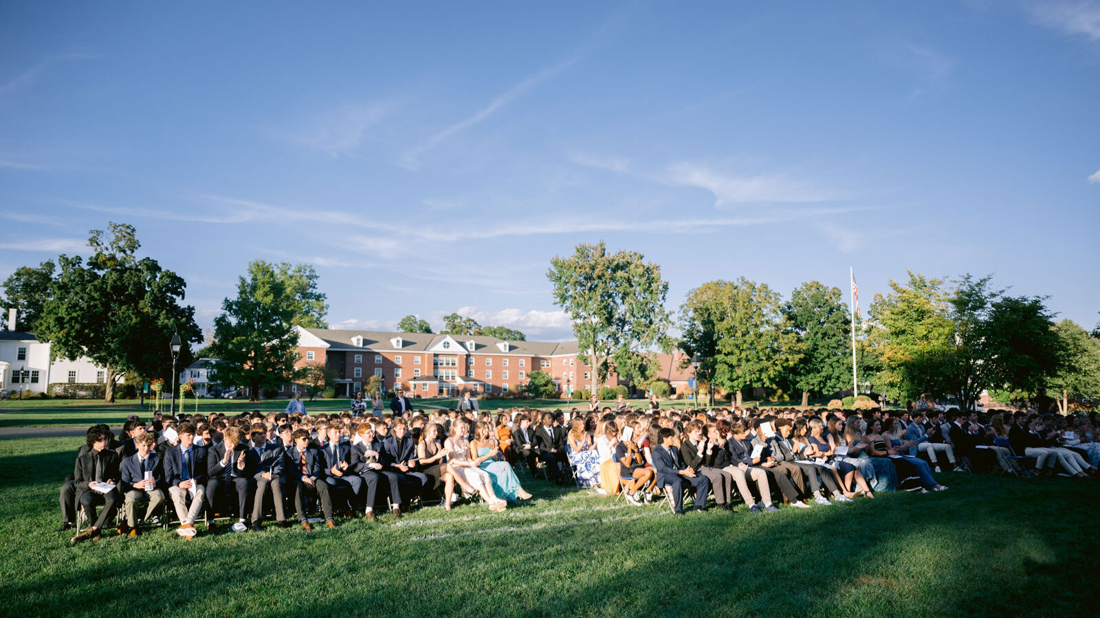 Crowd of people sitting in chairs