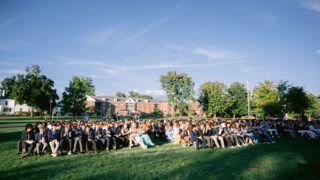 Crowd of people sitting in chairs