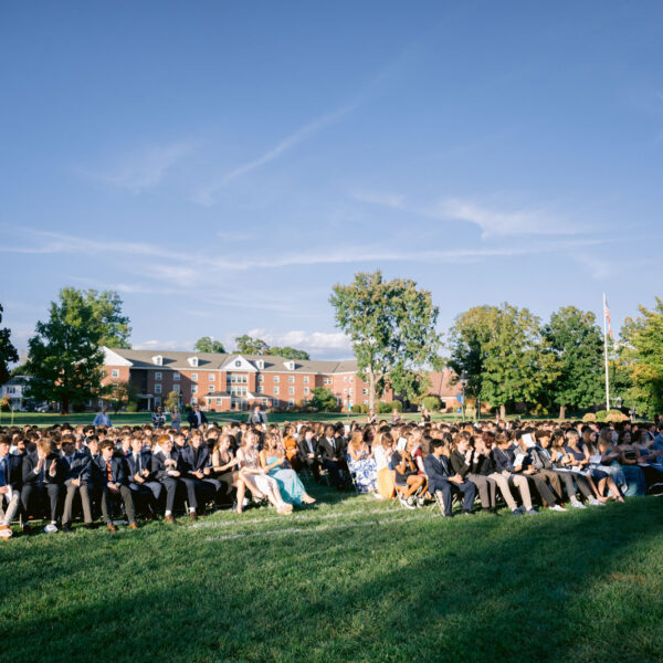 Crowd of people sitting in chairs