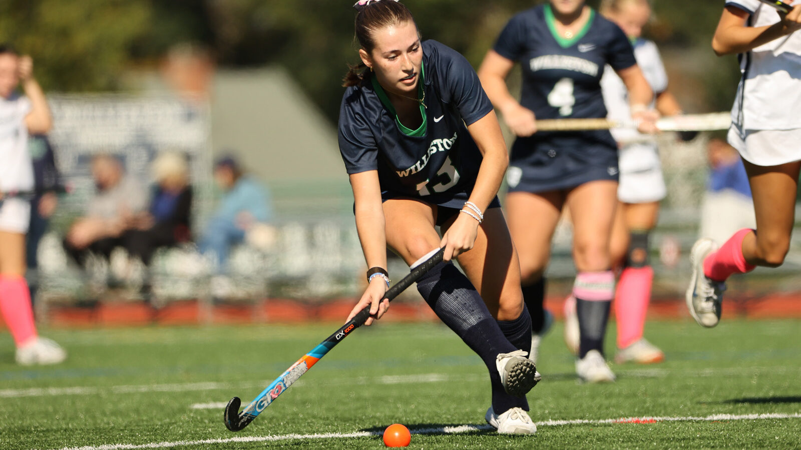 A Williston field hockey player goes to hit the ball