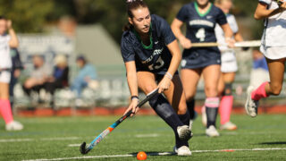 A Williston field hockey player goes to hit the ball