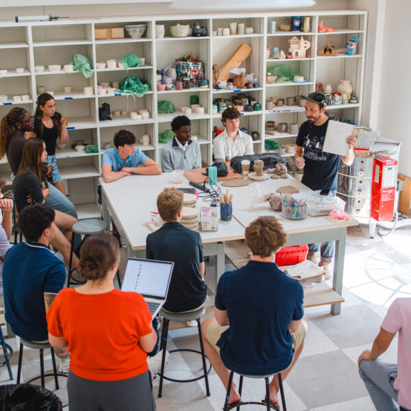 A Grum Project artist speaks to students during a class