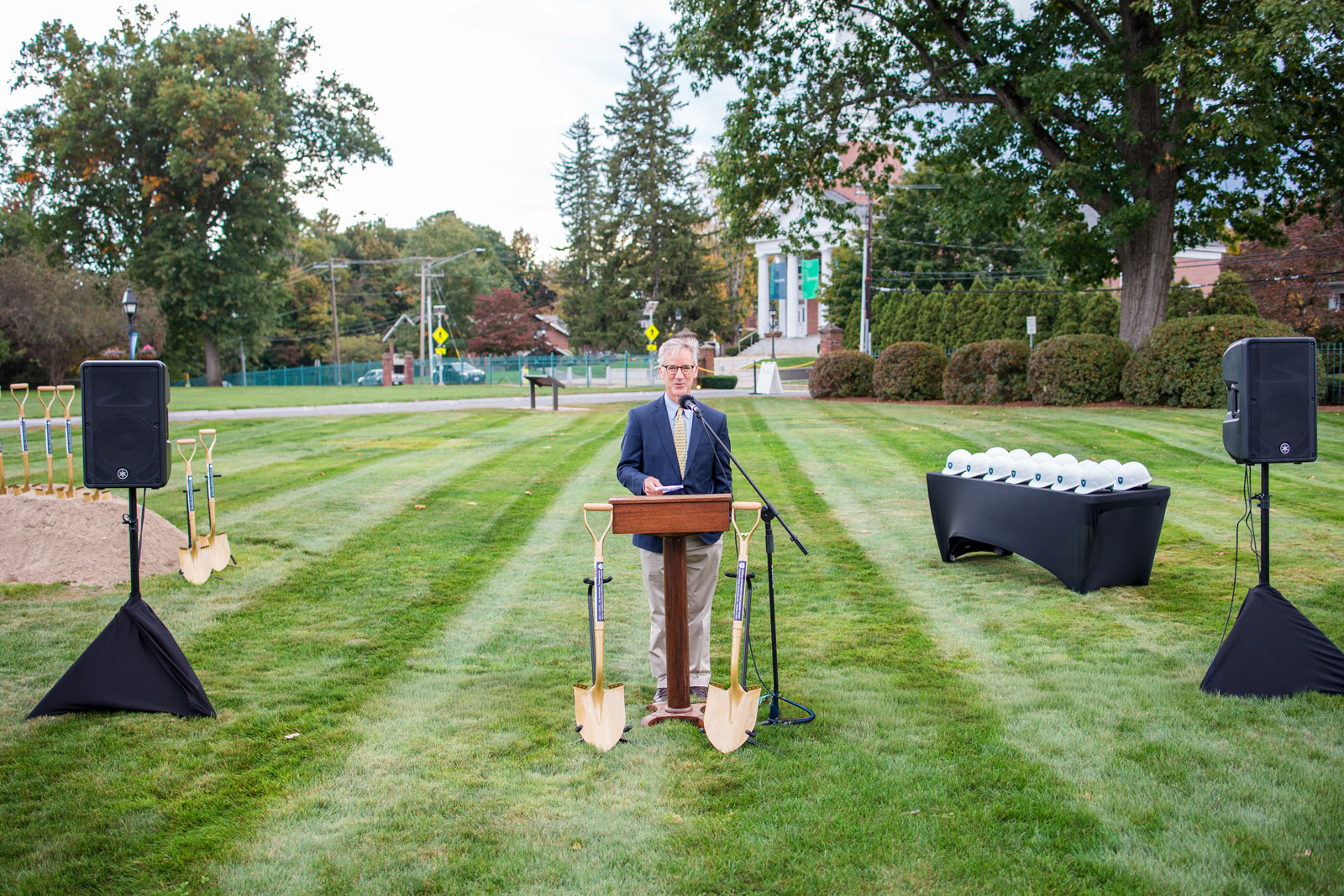 Man speaks at podium during groundbreaking